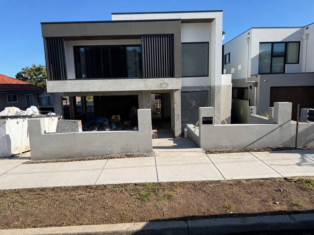 Two-storey modern home under construction on a Sydney street